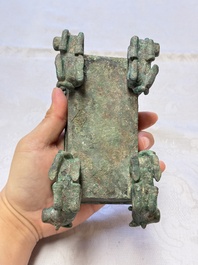 A Chinese archaic bronze cosmetic box standing on four stylised buffalo-form feet, Lian 奩, Eastern Zhou/Spring and Autumn