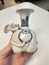 Two Chinese blue and white recumbent elephant-form candlesticks, Jiaqing