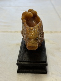 A Chinese precious-stone-inlaid carved soapstone wine vessel on stand, Gong 觥, Republic