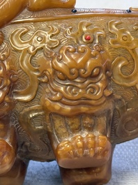 A Chinese precious-stone-inlaid carved soapstone wine vessel on stand, Gong 觥, Republic