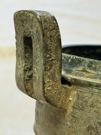 A Chinese archaic bronze tripod food vessel and cover, Ding 鼎, Eastern Zhou