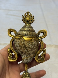 A Chinese parcel-gilt cloisonn&eacute; and bronze 'Conch Shell' Buddhist emblem, 18/19th C.