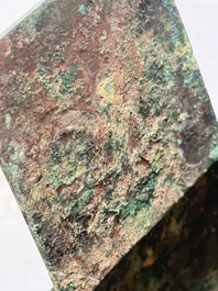 A Chinese archaic bronze cosmetic box standing on four stylised buffalo-form feet, Lian 奩, Eastern Zhou/Spring and Autumn