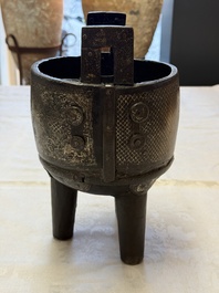 A Korean silver-inlaid iron 'He Lu Tong Chun 鶴鹿同春' tripod censer, Joseon, 18th C.