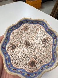 A Chinese famille rose nine-piece 'Plum Blossoms' sweetmeat set on a wooden tray, 19th C.