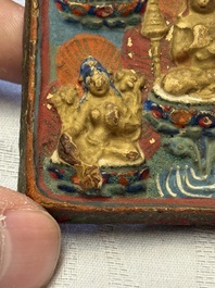 A gilt polychrome stucco votive plaque, Tsha Tsha, Tibet, 18/19th C.