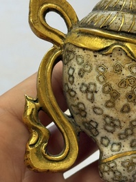 A Chinese parcel-gilt cloisonn&eacute; and bronze 'Conch Shell' Buddhist emblem, 18/19th C.