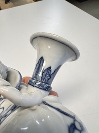 Two Chinese blue and white recumbent elephant-form candlesticks, Jiaqing