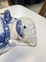 Two Chinese blue and white recumbent elephant-form candlesticks, Jiaqing