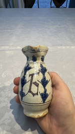 A rare intact early Italian maiolica ewer inscribed 'G', Montelupo, 15th C.