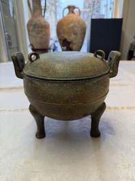 A Chinese archaic bronze tripod food vessel and cover, Ding 鼎, Eastern Zhou