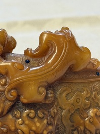 A Chinese precious-stone-inlaid carved soapstone wine vessel on stand, Gong 觥, Republic