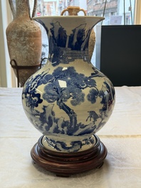A Chinese blue and white '100 Deers' 'Zun' vase on wooden stand, Kangxi mark, 19th C.