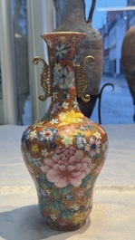 A pair of Chinese famille rose 'Millefleur' vases, Qianlong mark, Republic