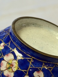 A Chinese Canton enamel 'Prunus on Cracked Ice' spittoon and two snuff dishes, 19th C.