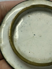 A Chinese Canton enamel 'Prunus on Cracked Ice' spittoon and two snuff dishes, 19th C.
