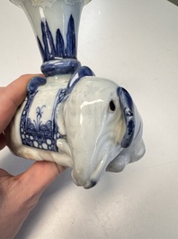 Two Chinese blue and white recumbent elephant-form candlesticks, Jiaqing