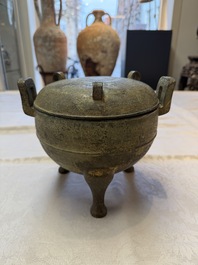 A Chinese archaic bronze tripod food vessel and cover, Ding 鼎, Eastern Zhou