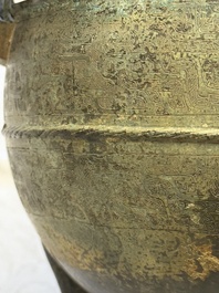 A Chinese archaic bronze tripod food vessel and cover, Ding 鼎, Eastern Zhou