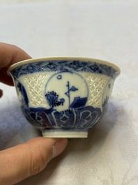 A Chinese blue and white reticulated double-walled cup and a pierced 'Hatcher Cargo' type bowl, Transitional/Kangxi