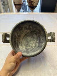 A Chinese archaic bronze tripod food vessel and cover, Ding 鼎, Eastern Zhou