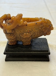 A Chinese precious-stone-inlaid carved soapstone wine vessel on stand, Gong 觥, Republic