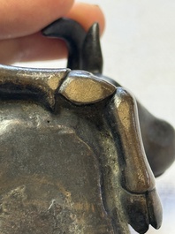 A Chinese bronze 'Boy and Buffalo' paperweight, Ming