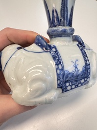 Two Chinese blue and white recumbent elephant-form candlesticks, Jiaqing