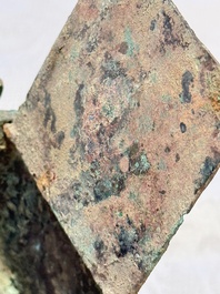 A Chinese archaic bronze cosmetic box standing on four stylised buffalo-form feet, Lian 奩, Eastern Zhou/Spring and Autumn