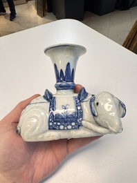 Two Chinese blue and white recumbent elephant-form candlesticks, Jiaqing