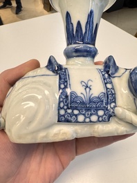 Two Chinese blue and white recumbent elephant-form candlesticks, Jiaqing