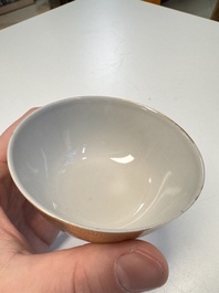 A pair of Chinese gilt-decorated sepia 'Riverscape' cups and saucers, Jiaqing