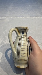 A rare intact early Italian maiolica ewer inscribed 'G', Montelupo, 15th C.
