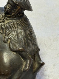 A Chinese bronze 'Boy and Buffalo' paperweight, Ming