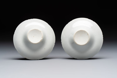 A pair of Chinese inscribed blue and white 'Clouds' tea bowls, covers and stands, Guangxu mark and of the period