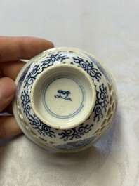 A Chinese blue and white reticulated double-walled cup and a pierced 'Hatcher Cargo' type bowl, Transitional/Kangxi