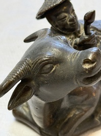 A Chinese bronze 'Boy and Buffalo' paperweight, Ming