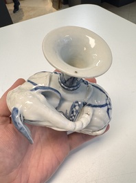Two Chinese blue and white recumbent elephant-form candlesticks, Jiaqing