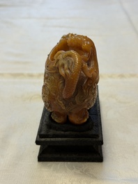A Chinese precious-stone-inlaid carved soapstone wine vessel on stand, Gong 觥, Republic