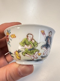 A Chinese famille rose 'Fishermen' cup and saucer, Yongzheng