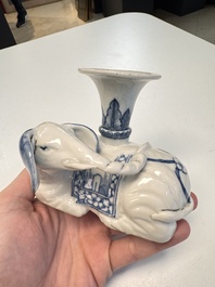 Two Chinese blue and white recumbent elephant-form candlesticks, Jiaqing