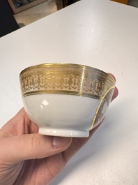 A pair of Chinese gilt-decorated sepia 'Riverscape' cups and saucers, Jiaqing