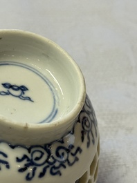 A Chinese blue and white reticulated double-walled cup and a pierced 'Hatcher Cargo' type bowl, Transitional/Kangxi