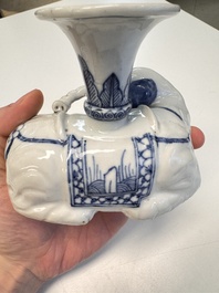 Two Chinese blue and white recumbent elephant-form candlesticks, Jiaqing