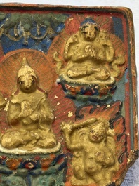 A gilt polychrome stucco votive plaque, Tsha Tsha, Tibet, 18/19th C.