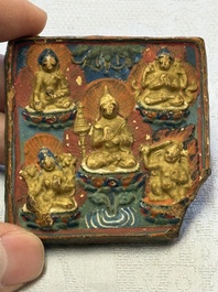 A gilt polychrome stucco votive plaque, Tsha Tsha, Tibet, 18/19th C.