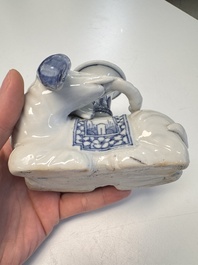 Two Chinese blue and white recumbent elephant-form candlesticks, Jiaqing