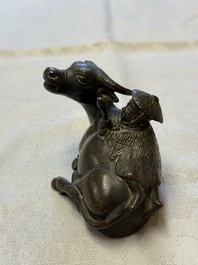 A Chinese bronze 'Boy and Buffalo' paperweight, Ming
