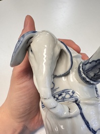 Two Chinese blue and white recumbent elephant-form candlesticks, Jiaqing