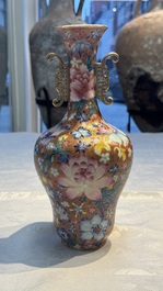 A pair of Chinese famille rose 'Millefleur' vases, Qianlong mark, Republic